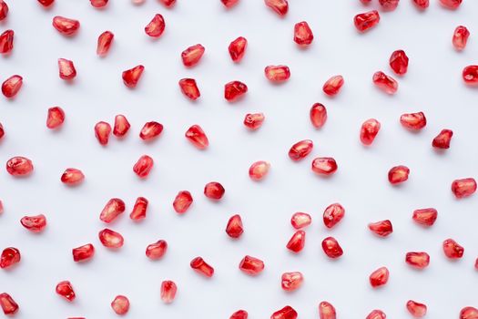 Pomegranate seeds on white background. Top view