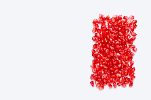 pomegranate seeds isolated on white background. Copy space