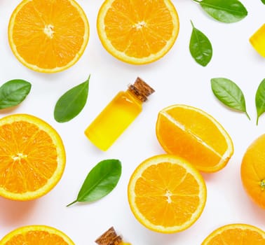 Citrus essential oil with fresh orange fruit isolated on white background.