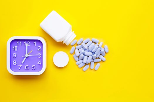 Clock with "PrEP" ( Pre-Exposure Prophylaxis). used to prevent HIV on yellow background. Copy space