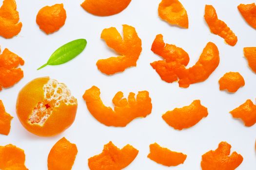 Orange with peel on white background. Top view