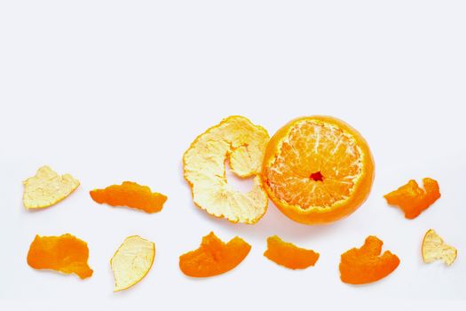 Orange with peel on white background.  Copy space