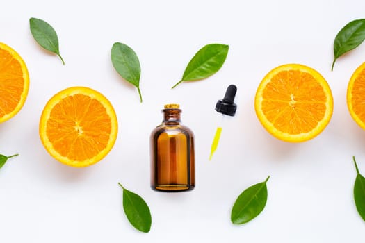 Citrus essential oil with fresh orange fruit isolated on white background. 