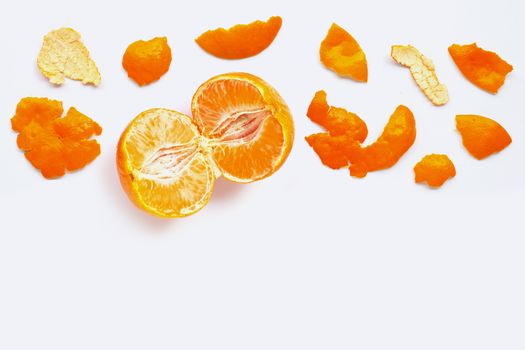 Orange with peel on white background.  Copy space