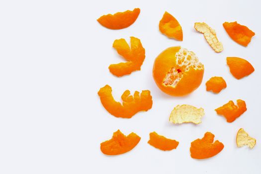 Orange with peel on white background.  Copy space