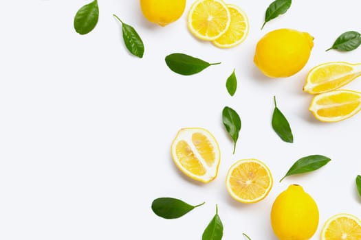 Fresh lemon with green leaves on white background.