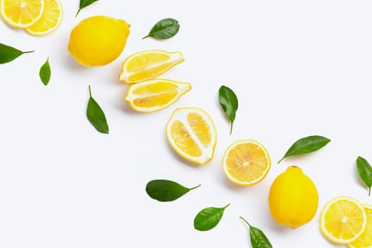 Fresh lemon with green leaves on white background.