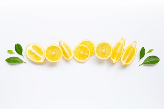 Fresh lemon with green leaves on white background.
