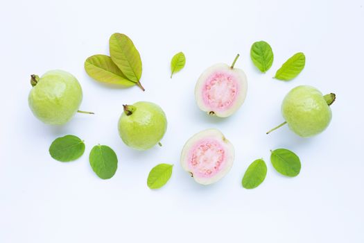 Top view of fresh ripe guava and slices with leaves.