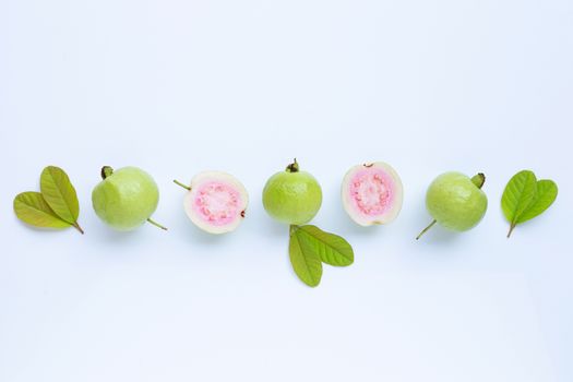 Top view of fresh ripe guava and slices with leaves.