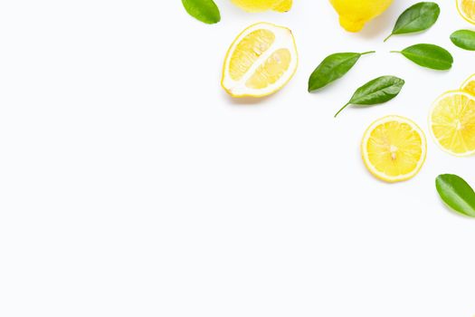 Fresh lemon with green leaves on white background.