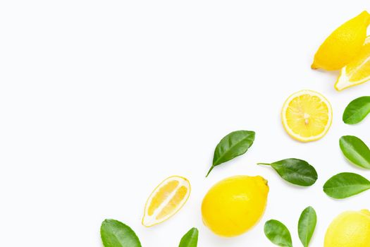 Fresh lemon with green leaves on white background.