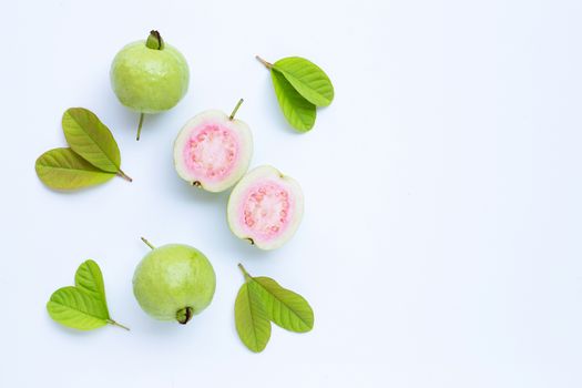Top view of fresh ripe guava and slices with leaves.