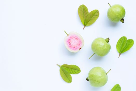 Top view of fresh ripe guava and slices with leaves.