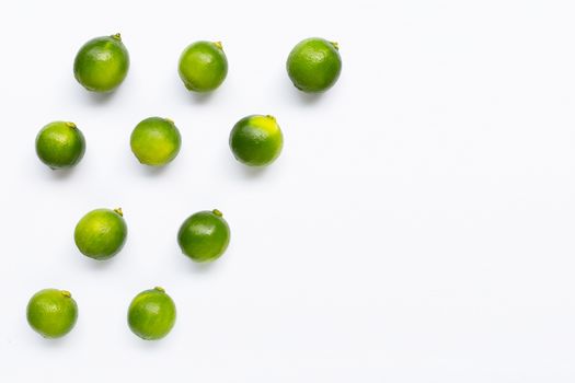 Limes isolated on white background. Top view