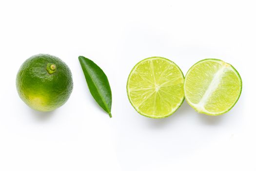 Limes with leaf isolated on white background.