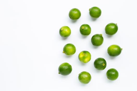 Fresh limes isolated on white background. Copy space