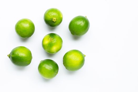 Fresh limes isolated on white background. Copy space