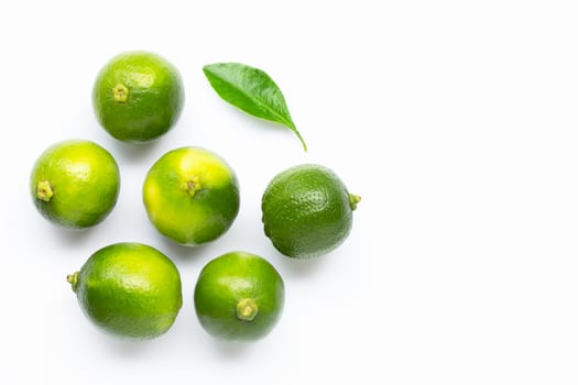 Limes with leaf isolated on white background. Copy space