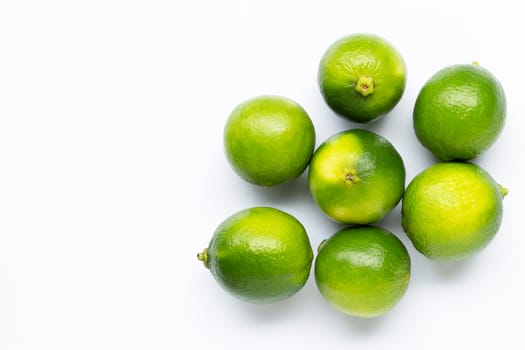 Fresh limes isolated on white background. Copy space
