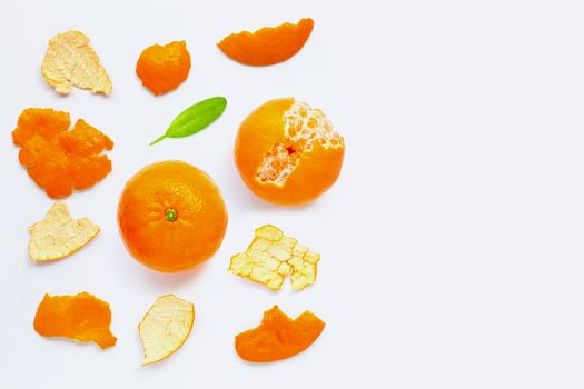 Orange with peel on white background.  Copy space