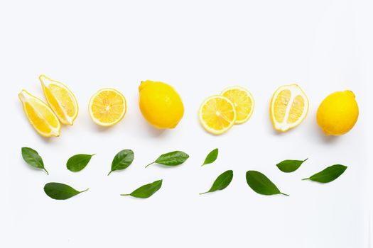 Fresh lemon with green leaves on white background.