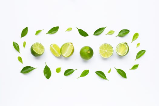 Limes with leaves isolated on white background.
