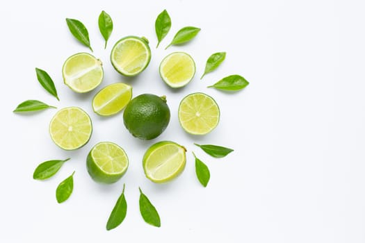 Limes with leaves isolated on white background. Copy space