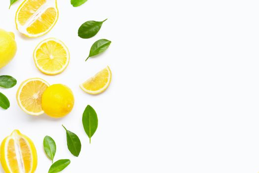 Fresh lemon with green leaves on white background. Copy space