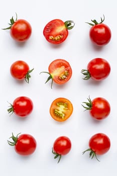 Fresh tomatoes, whole and half cut isolated on white background. Top view