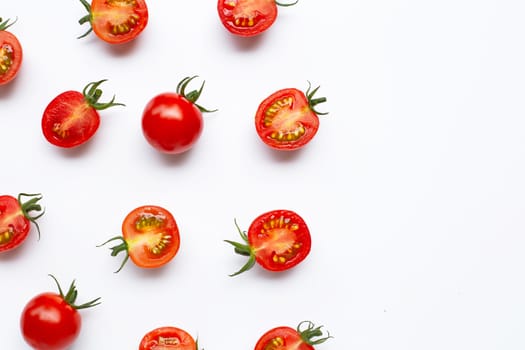 Fresh tomatoes, whole and half cut isolated on white background. Top view