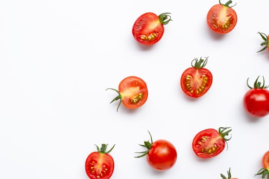 Fresh tomatoes, whole and half cut isolated on white background. Top view