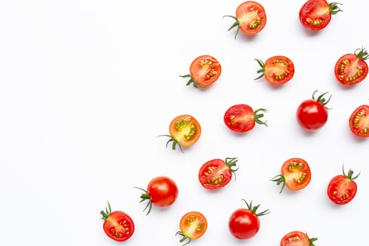 Fresh tomatoes, whole and half cut isolated on white background. Top view