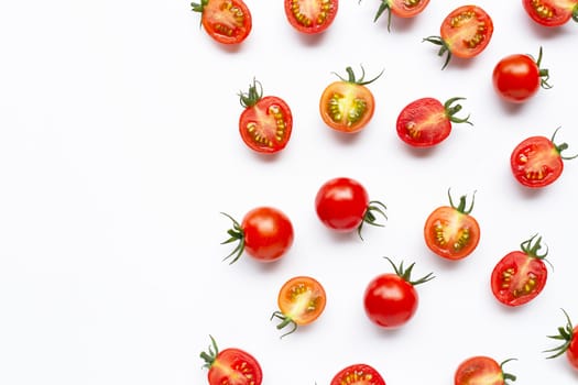 Fresh tomatoes, whole and half cut isolated on white background. Top view