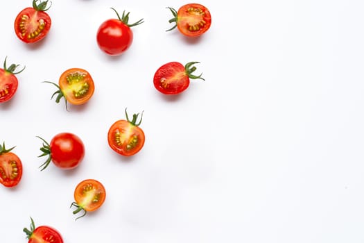 Fresh tomatoes, whole and half cut isolated on white background. Top view