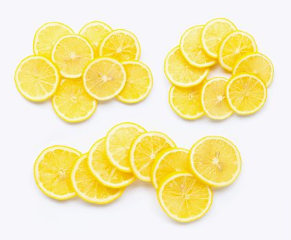 Fresh lemon slices on white background.