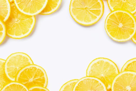 Frame made of fresh lemon with slices on white background. Copy space