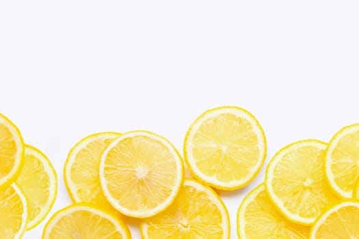 Frame made of fresh lemon with slices on white background. Copy space