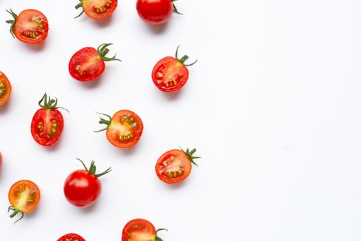 Fresh tomatoes, whole and half cut isolated on white background. Top view