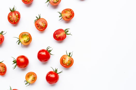 Fresh tomatoes, whole and half cut isolated on white background. Top view