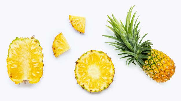 Fresh whole and cut pineapple isolated on white background. Top view