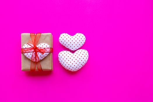 Valentine's heart with gift box  on pink background. Top view