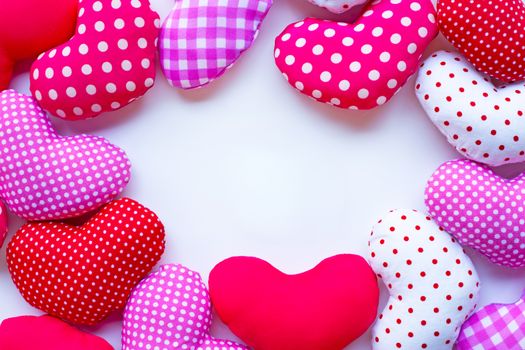 Frame of Valentine's hearts on white background, Top view