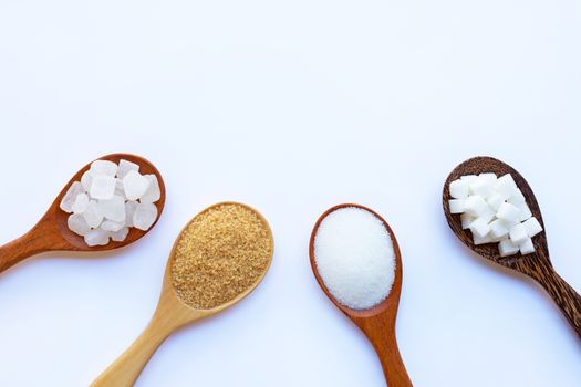 Various types of sugar on white background.