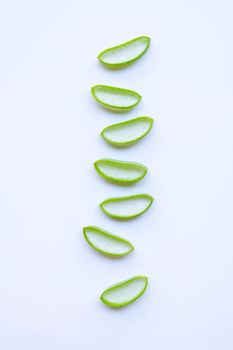 Aloe vera slices on white background.