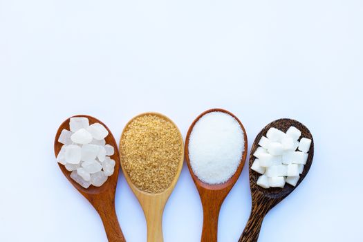 Various types of sugar on white background.