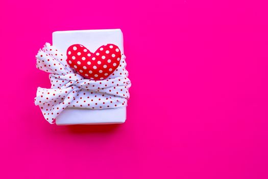 Valentine's day with gift box  on pink background. Copy space