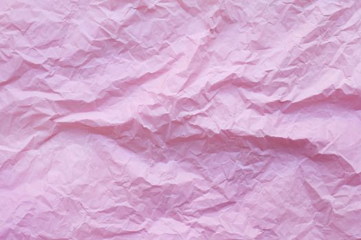 Pink crumpled recycle paper background