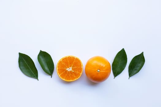 Fresh orange citrus fruit with leaves isolated on white background.  Top view