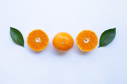 Fresh orange citrus fruit with leaves isolated on white background.  Top view